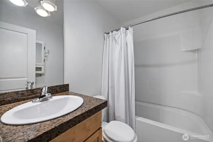 Clean, functional bathroom ready for your personal touch.