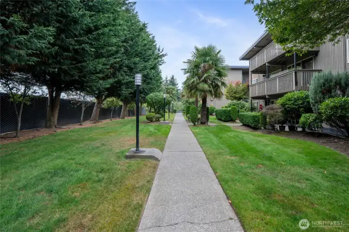 Lush green common areas throughout the property.