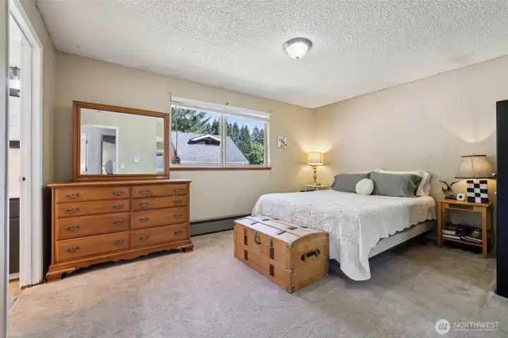 Spacious primary bedroom with a private .75 BA.