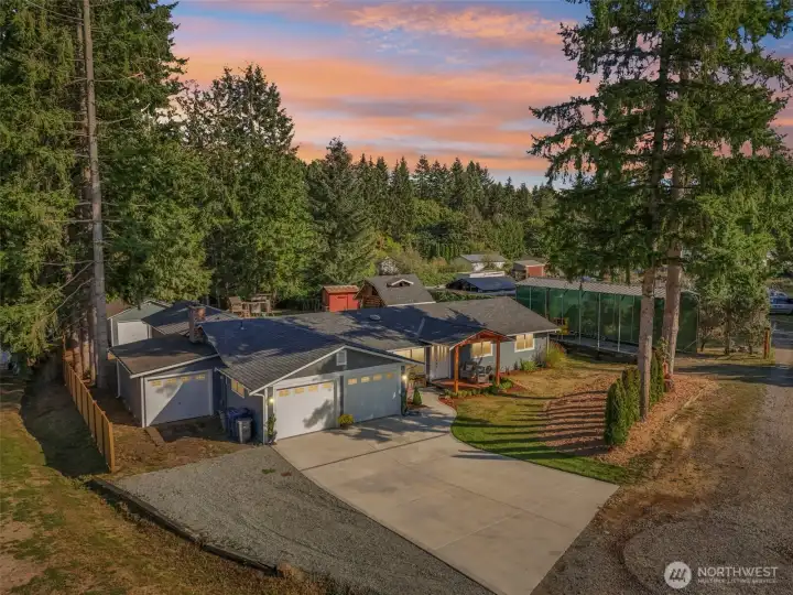 Tons of parking, 3-car attached garage(s) and RV parking in front. 3rd bay is a pull-through garage (not shown in photo).