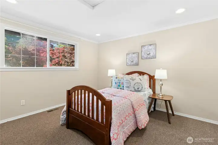 Roomy upstairs corner bedroom at the end of the hallway.