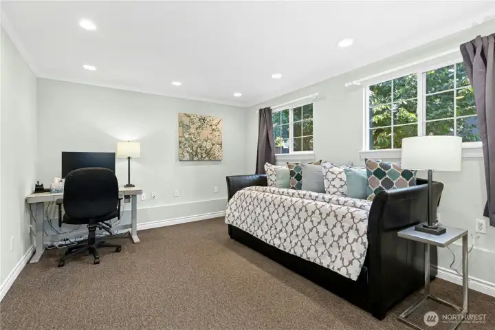 Versatile home layout includes this lower-level bedroom, perfect for a home office, exercise room, or guest space.