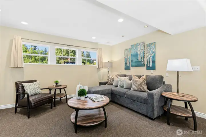 Spacious lower-level recreation room is perfect for games, home theater, and other gatherings in this Kirkland home.