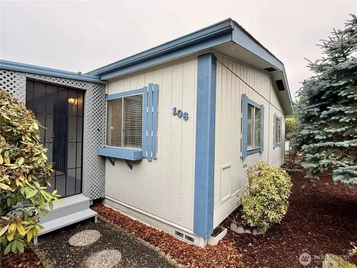 Nice landscaping and pathway leading to the covered front porch.