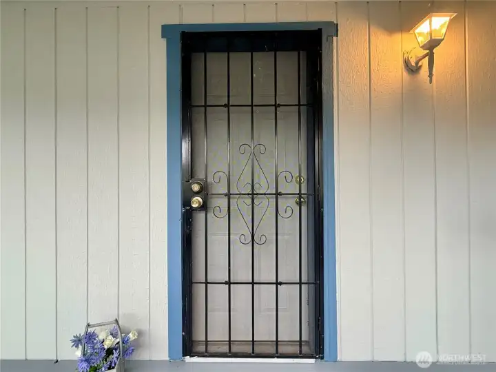 Front door with screen door.
