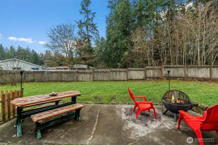 Patio off kitchen looks out at trees and nature
