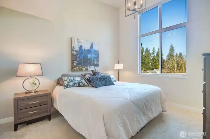 Primary Bedroom with large walk-in Closet and vaulted ceilings.