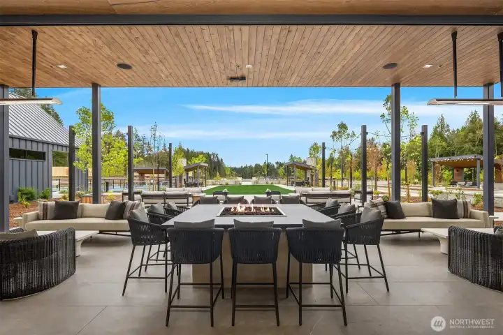 Large covered patio area with fire table