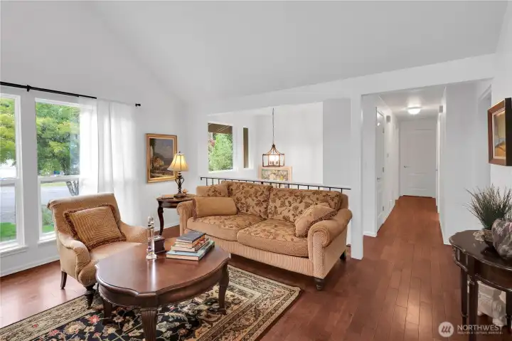 Formal living room with cathedral ceilings.