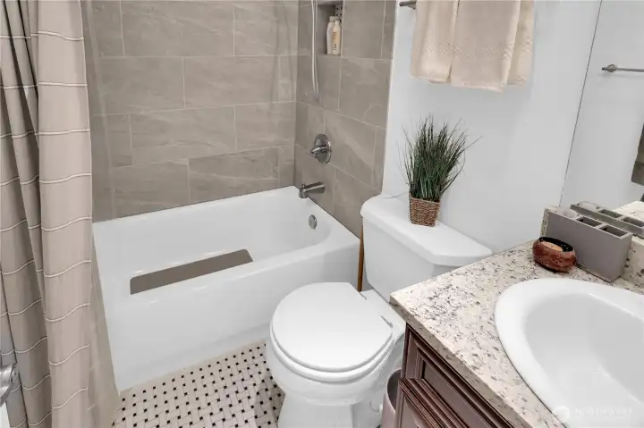 Main full bath has been tastefully upgraded.