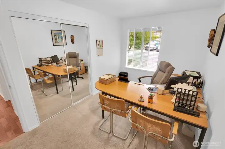 Guest bedroom 3 with closet organizer used as an office.