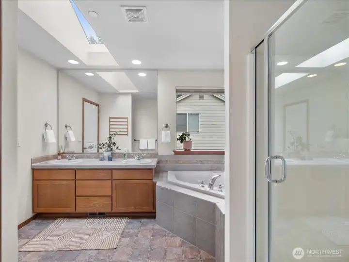 Primary bathroom is bright, light, and functional.