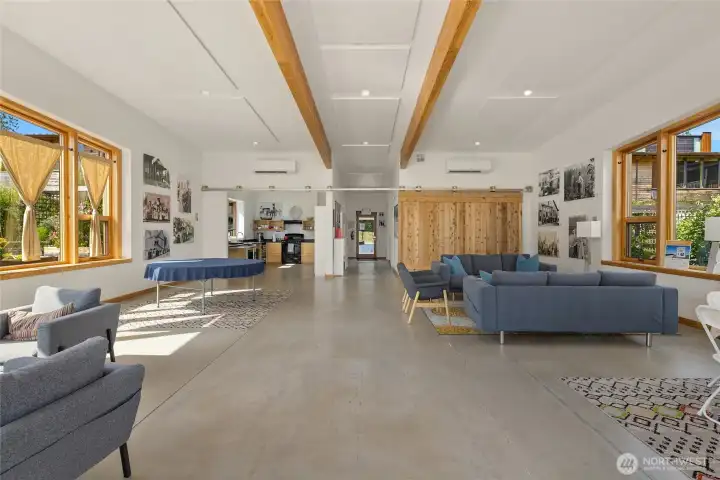 The community center is thoughtfully equipped with a full kitchen, two easily accessible bathrooms, a cozy library, and a selection of indoor and outdoor games.