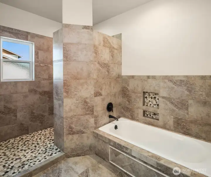 Light and bright primary en-suite bathroom