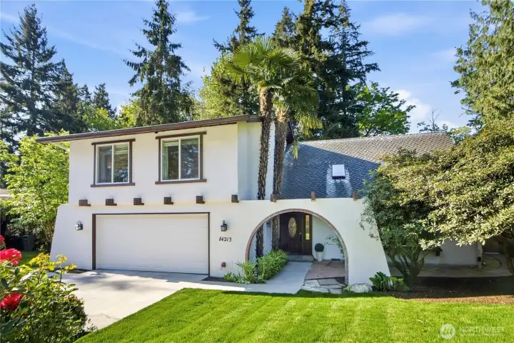 Beautifully maintained exterior with fresh landscaping and spacious driveway