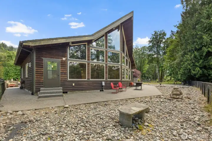 Floor to ceiling windows with river and mountain views