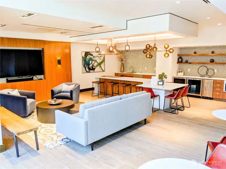 Club lounge w/ chef-grade appliances, big screen TV and plenty of seating.