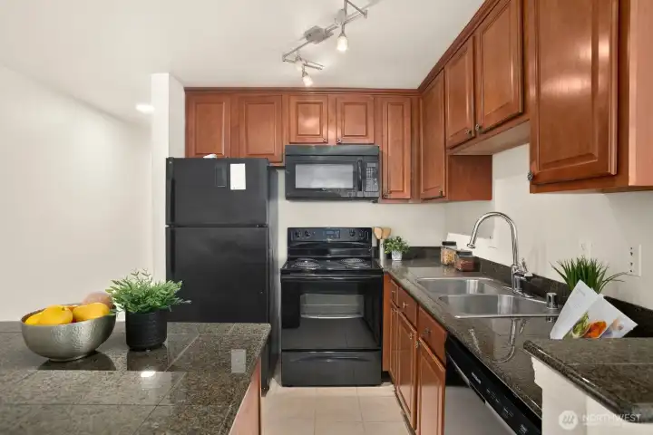 Beautiful Kitchen with Granite counters and cherry cabinets
