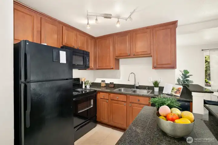 Beautiful Kitchen with Granite counters and cherry cabinets
