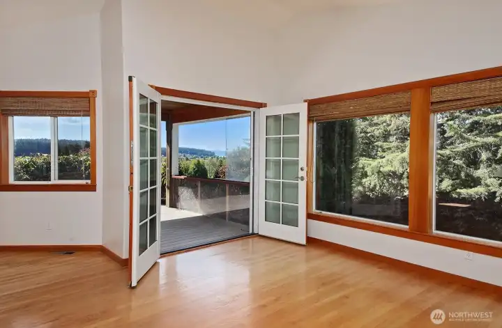 Double French doors lead to the covered deck.