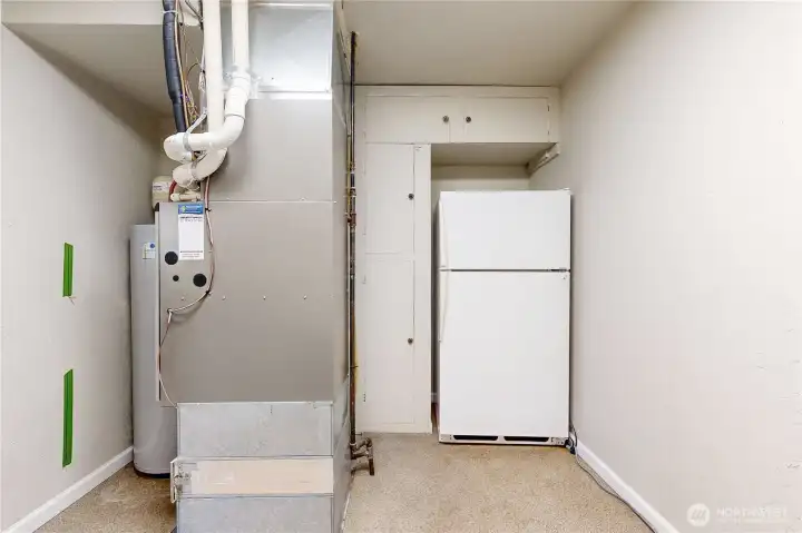 utility room with storage and extra fridge stays!