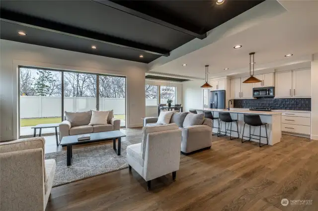 Open Living with Trayed Ceilings and Faux Beams