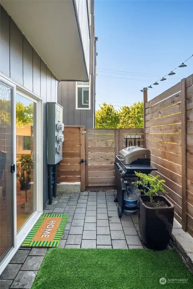 This fully fenced ground floor patio is plumbed for gas, is turfed and has room for storage.