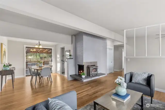 Dining Room view shows wood stove that makes the home very cozy on those chilly days.