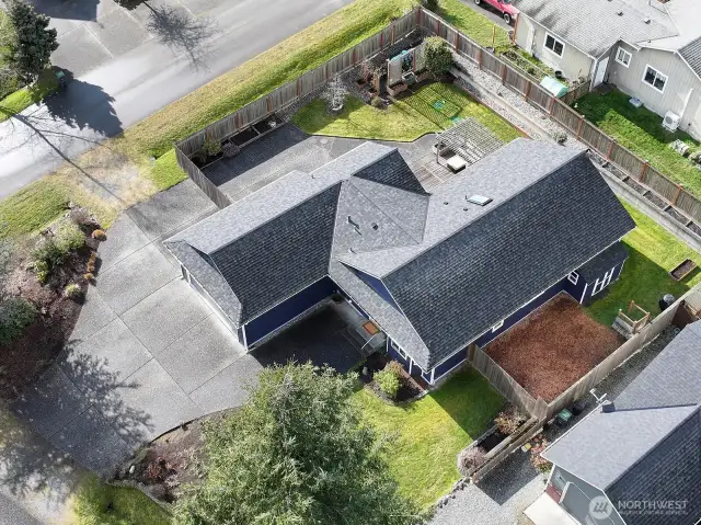 Birdseye view. You can get a sense of the number of garden beds. There's even a compost bin. New roof 2021.