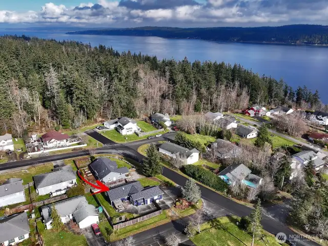 Your proximity to Holmes Harbor and another view that reflects the privacy and sunshine that comes with this corner lot.