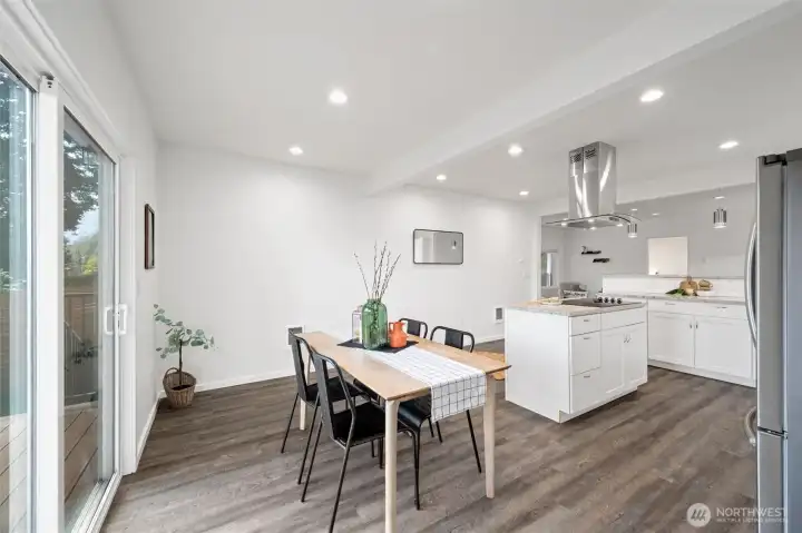 The dining room opens out to the new Trex deck and is open to the kitchen.