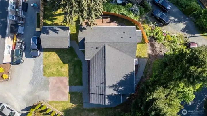 Looking down on the home and shop with the evergreens surrounding it.