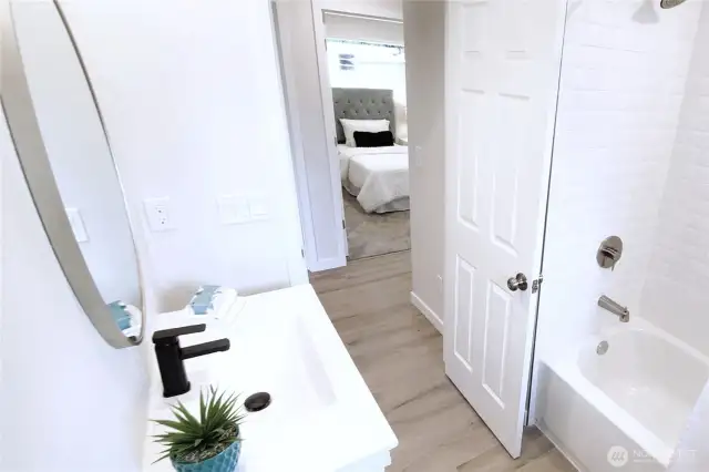 Main Bath completely renovated with brand new shower, bathtub tile & custom alcove.