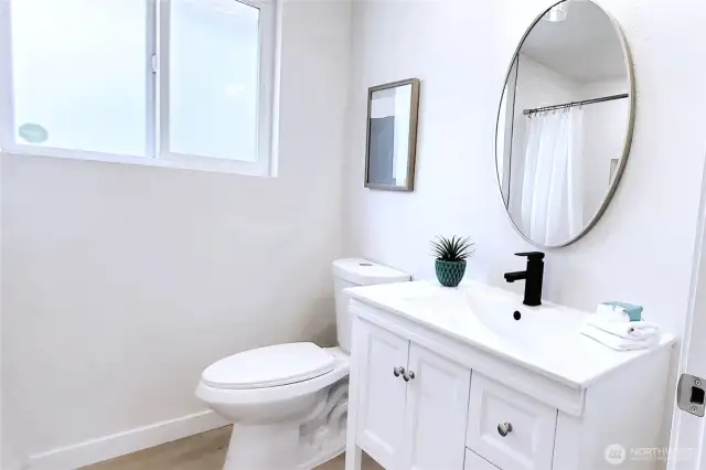 Main Bath completely renovated with brand new vanity, sink faucet & toilet