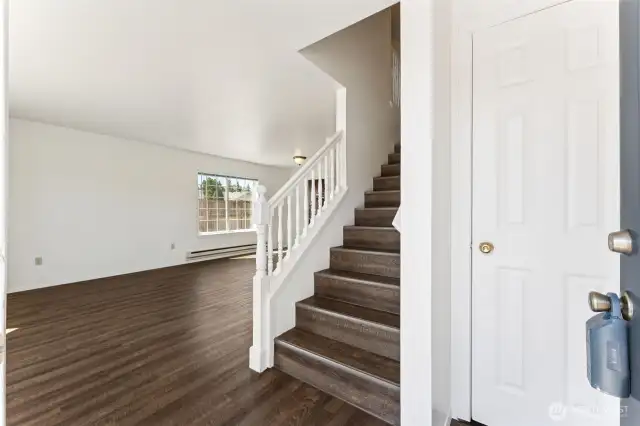Entry to large greatroom with luxury vinyl plank for easy maintenance.
