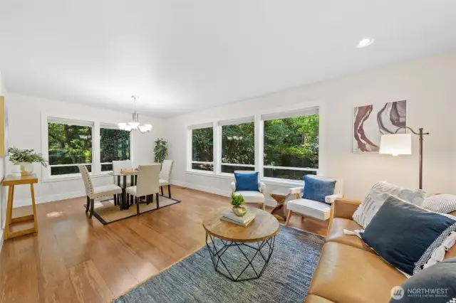 Just off the kitchen, this versatile space offers endless potential—use it as a casual dining nook, a sunny reading area, or a relaxed spot for morning coffee with views of nature around you.