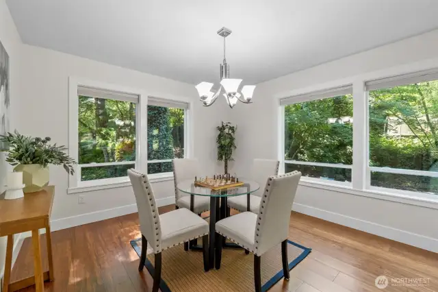 Surrounded by windows and natural light, this flexible corner is ideal for a breakfast table, game nights, or a quiet work-from-home setup—tailored to fit your lifestyle. Notice the Top Down Bottom Up shades.