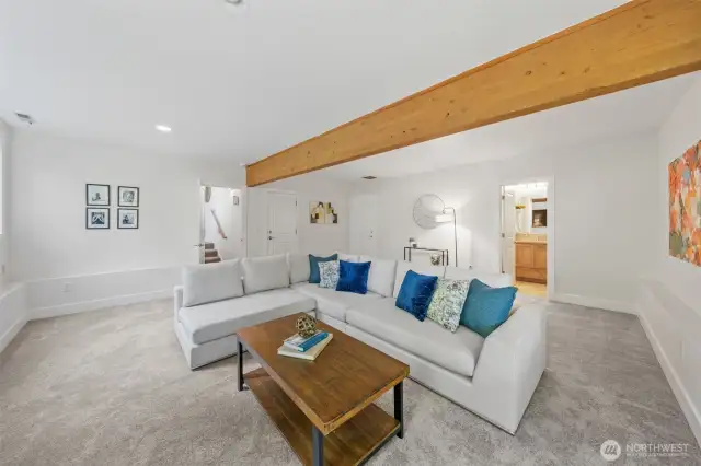 Spacious and versatile, this lower-level den is ideal for movie nights, play space, or a home gym—with a nearby bathroom and direct access to the 2-car attached garage and utility room just steps away.
