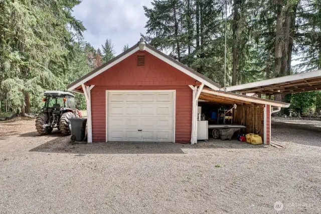 The one car garage with additional storage. The area on the side is ideal for RV or tractor parking.