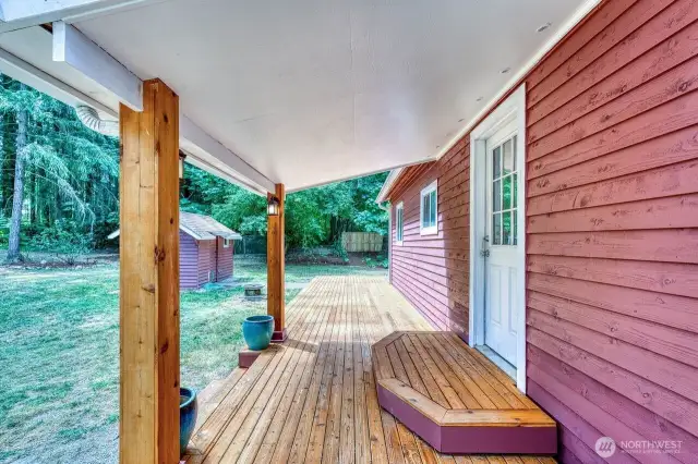 The entry and big deck, pump house on the left.