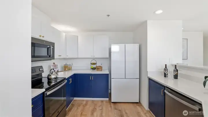 Contemporary two-tone cabinetry adds a bold touch to this bright, efficient space.