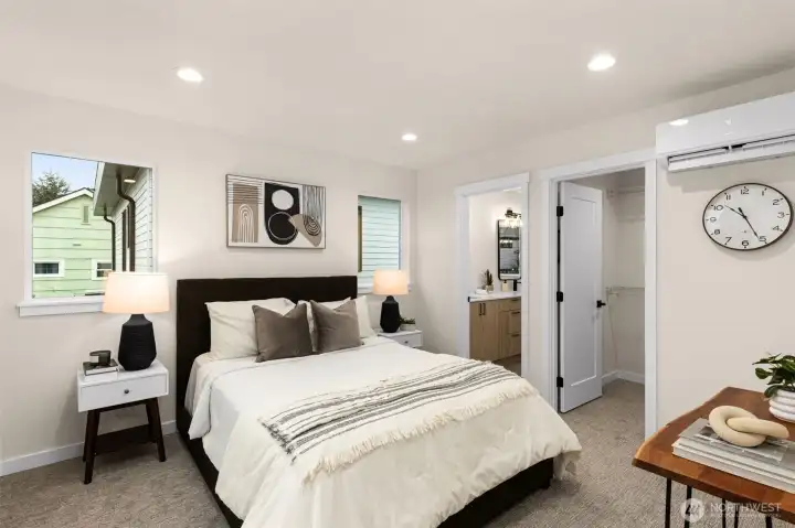 With room for a king sized bed - the primary features an en-suite & walk-in closet