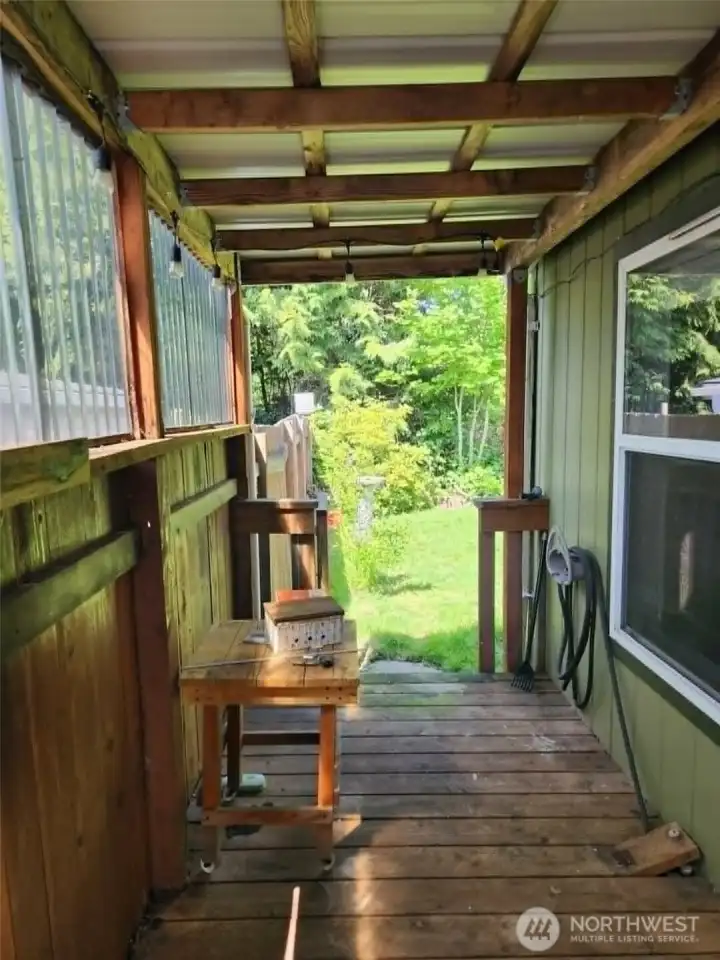 Front porch allows for plenty of space for a grill. Also gated giving you access to private back yard with 2 raised garden beds.