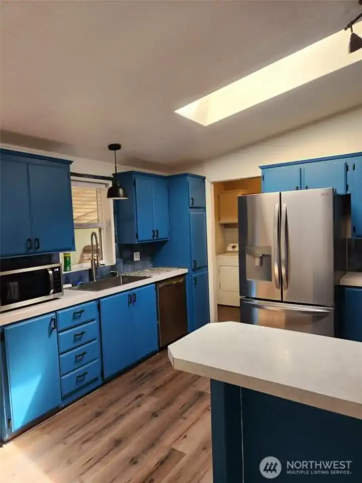 Kitchen with eat in space. New flooring in dining, kitchen and laundry.