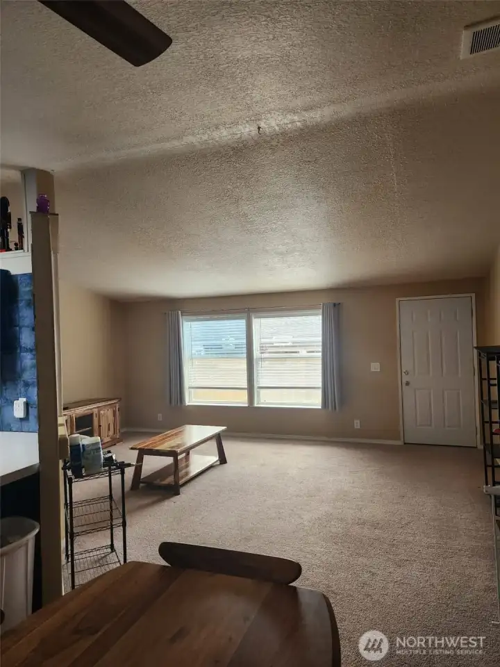 Light and bright living room opens to dining room