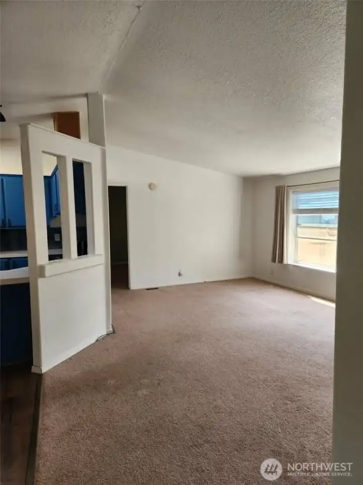 Light and bright living room off dining and kitchen.
