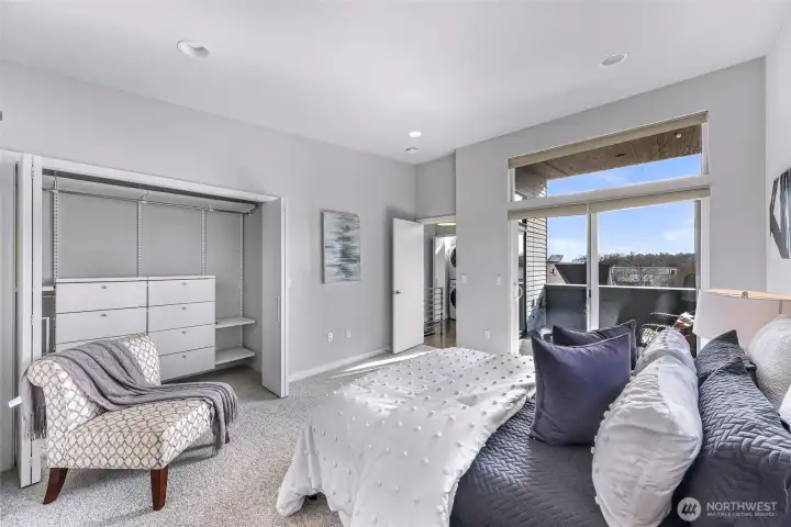 Primary showing large closet with custom orginizers.