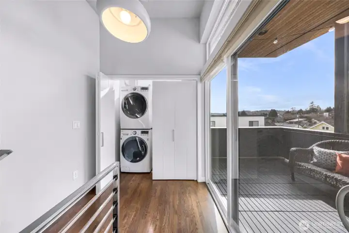 Washer Dryer at the foot of the stairs on upper level.