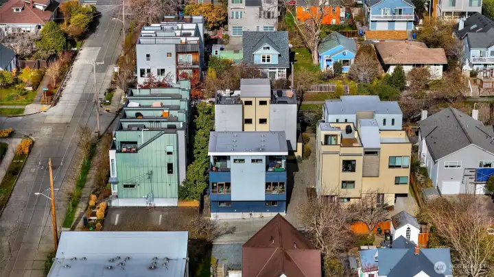 Drone shot of the townhome in the middle.