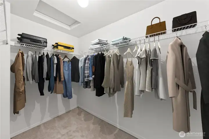 Spacious and flexible use space in this walk-in primary closet